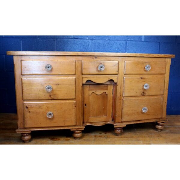 A Victorian Waxed Pine Farmhouse Dresser Raised on Turned Feet