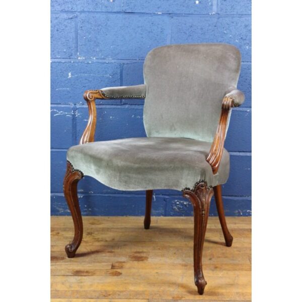 An Antique Carved Walnut Open Armchair Upholstered in Blue Velvet