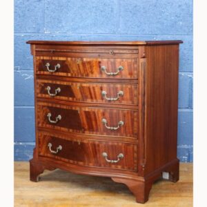 A Georgian Style Mahogany Serpentine Fronted Bachelors Chest of Drawers with Brushing Slide