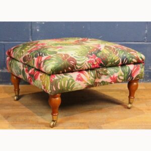 A Large Square Footstool or Ottoman with Storage, Reupholstered in Stylised Material Raised on Turned Supports