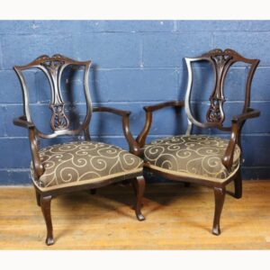 A Pair of Victorian Carved Mahogany Open Arm Chairs Raised on Cabriole Legs