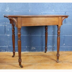 An Art Nouveau Carved Mahogany Desk or Side Table, Raised on Turned Supports