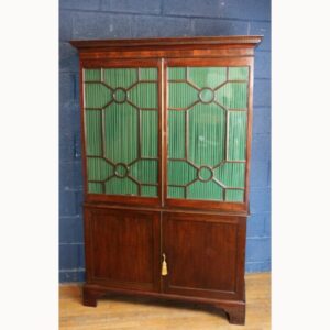 A Georgian Mahogany Astrical Glazed Bookcase over Fitted Cabinet Base