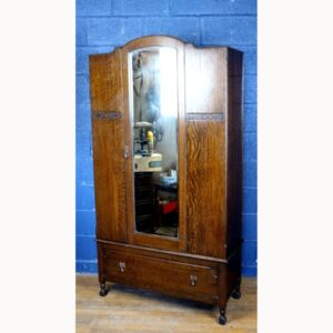 A C1930s Carved Oak Mirror Fronted Single Door Wardrobe