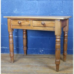 A Victorian Waxed Pine Two Drawer Side Table, Raised on a Turned Supports