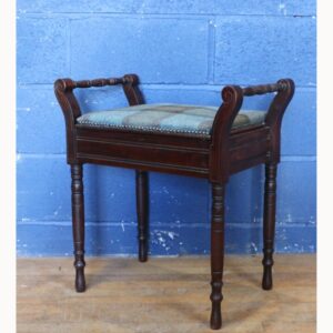 A Victorian Carved Walnut Piano Stool with Under Seat Storage Raised on Turned Supports