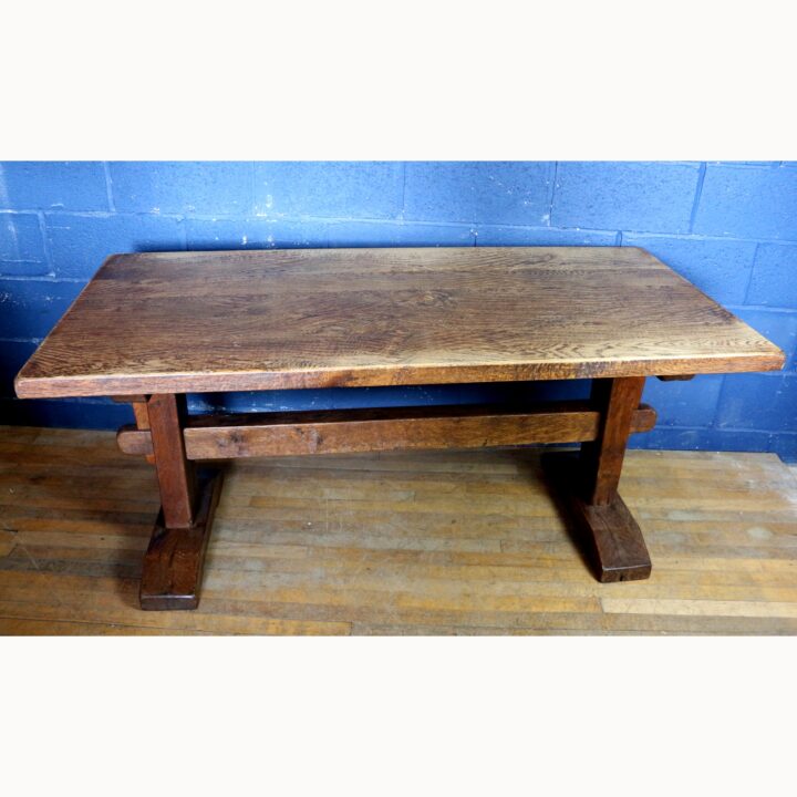 A Rustic Solid Oak Trestle Dining Table along with Set of Four Ladder Back Rush Seat Dining Chairs - Image 2