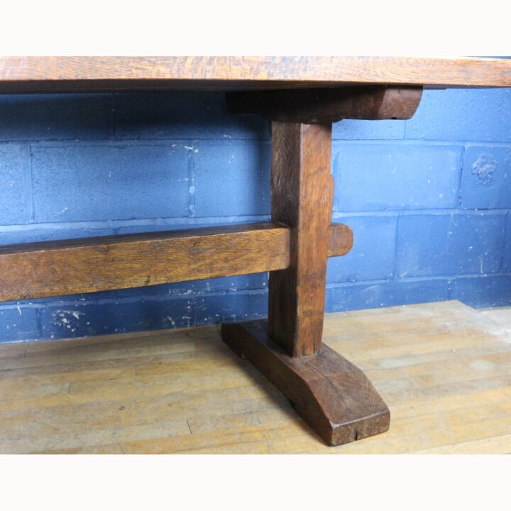A Rustic Solid Oak Trestle Dining Table along with Set of Four Ladder Back Rush Seat Dining Chairs - Image 10