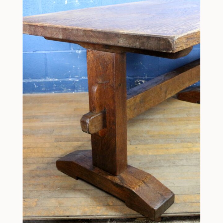A Rustic Solid Oak Trestle Dining Table along with Set of Four Ladder Back Rush Seat Dining Chairs - Image 9