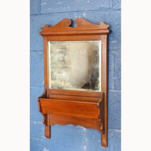 An Edwardian Carved Mahogany Entranceway Mirror with Storage Shelf