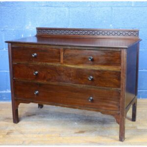 An Edwardian Carved Mahogany Two over Two Chest of Drawers