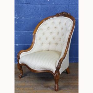 A Victorian Carved Walnut Deep Buttoned Open Armchair Raised on Cabriole Supports
